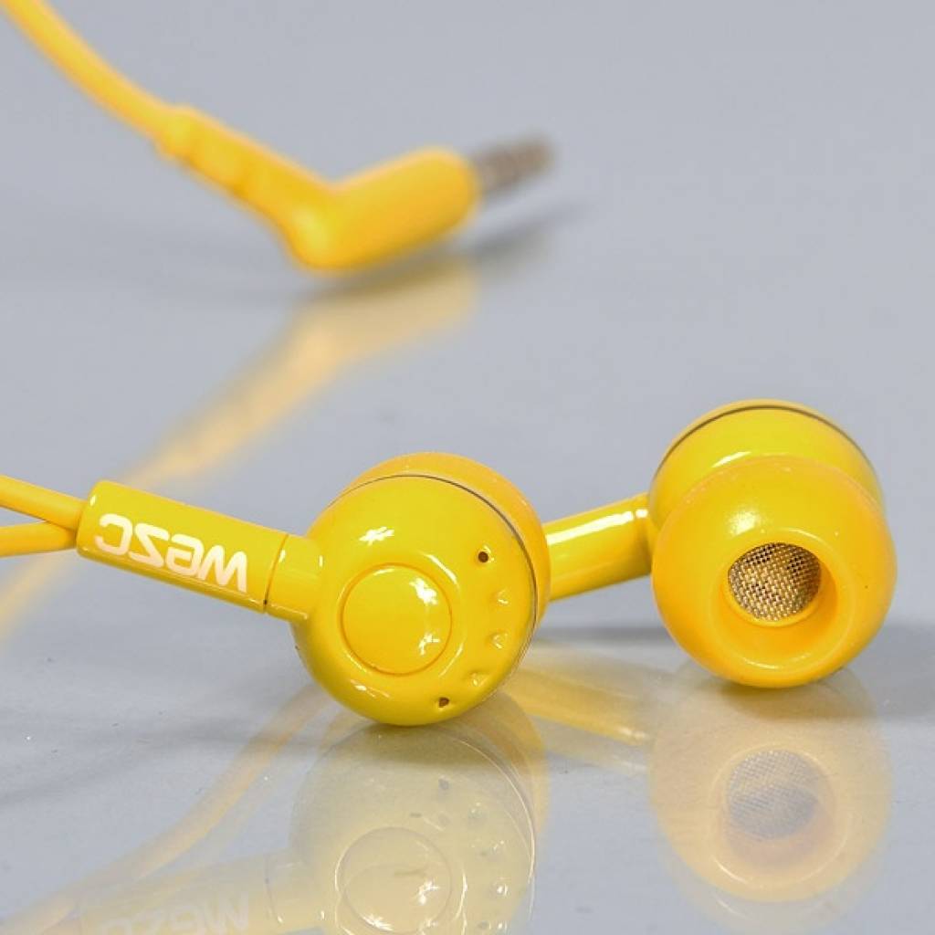 WeSC Kazoo Yellow in ear
