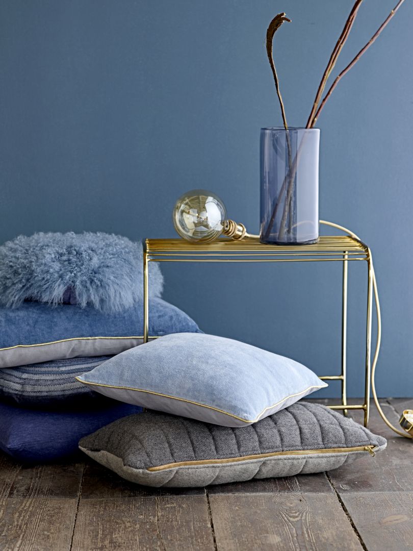 Decoreer je huis met kussens en vloerkleden