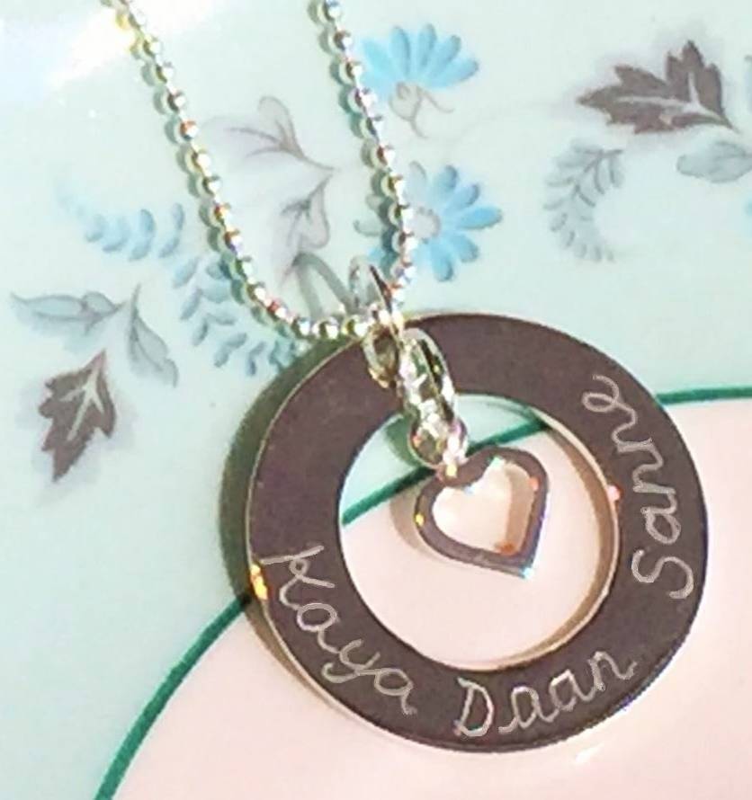 Engraved silver round pendant with six names KAYA jewellery UK